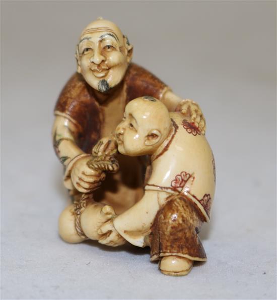 A Japanese ivory polychrome decorated netsuke, first half 20th century, height 4cm